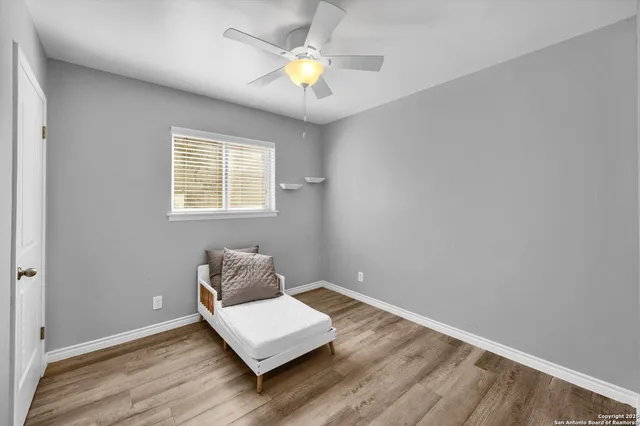 a room with window and ceiling fan