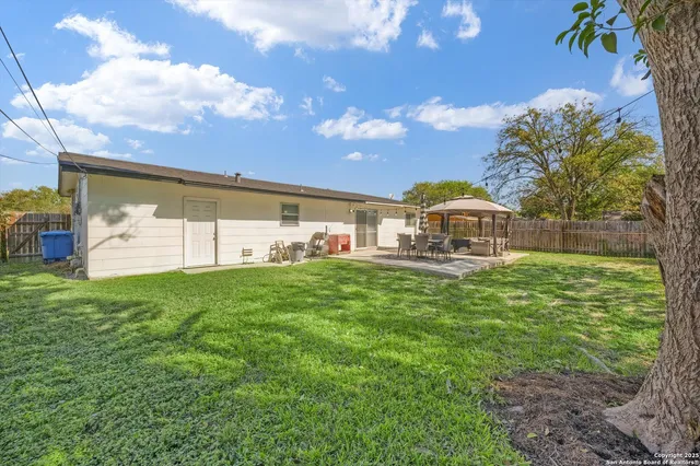 a view of a house with a big yard