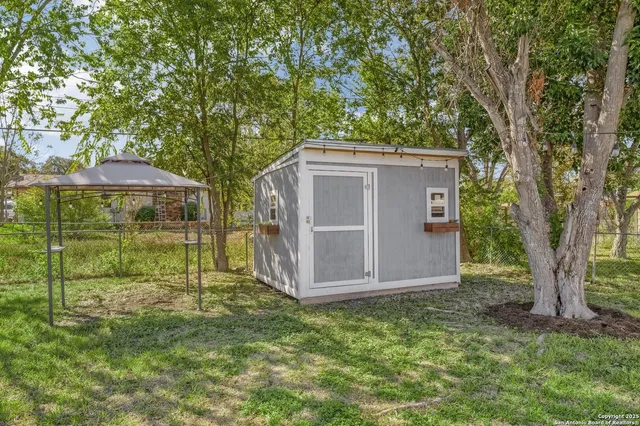 a house with trees in front of it