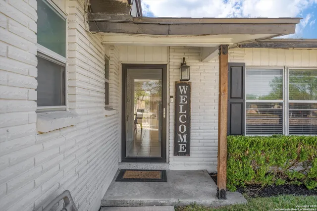 a view of potted plant in front of a door