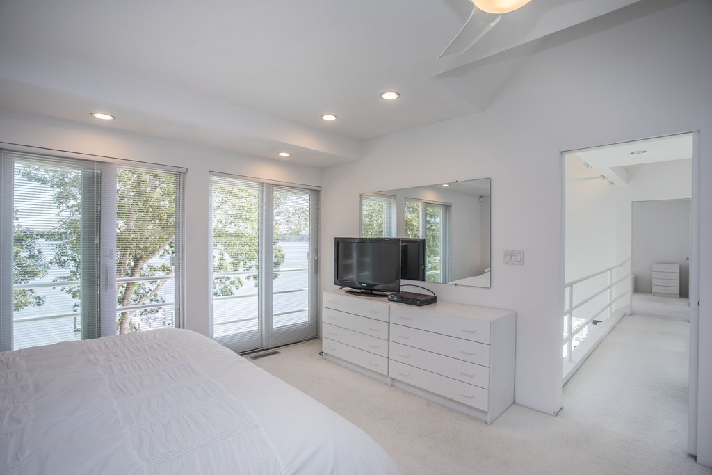 35 Pine Ridge Road Bourne, MA 02532 - Photo 14 of 30 a bedroom with furniture and flat screen tv