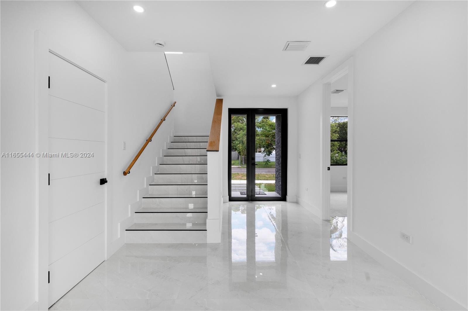 2340 Southwest 13th Street, Unit 2340 Miami, FL 33145 - Photo 11 of 26 wooden floor in an empty room with a window