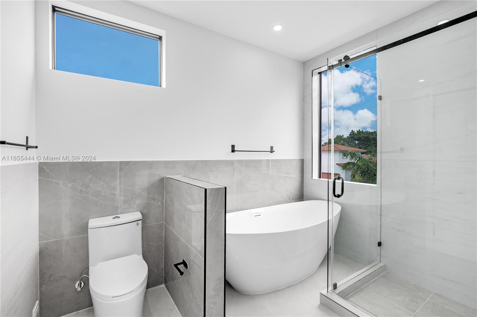 2340 Southwest 13th Street, Unit 2340 Miami, FL 33145 - Photo 16 of 26 a bathroom with a toilet and a shower