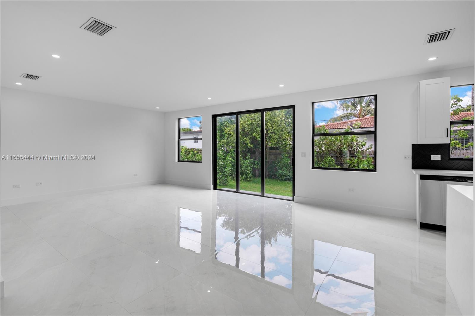 2340 Southwest 13th Street, Unit 2340 Miami, FL 33145 - Photo 8 of 26 a living room with furniture and large windows