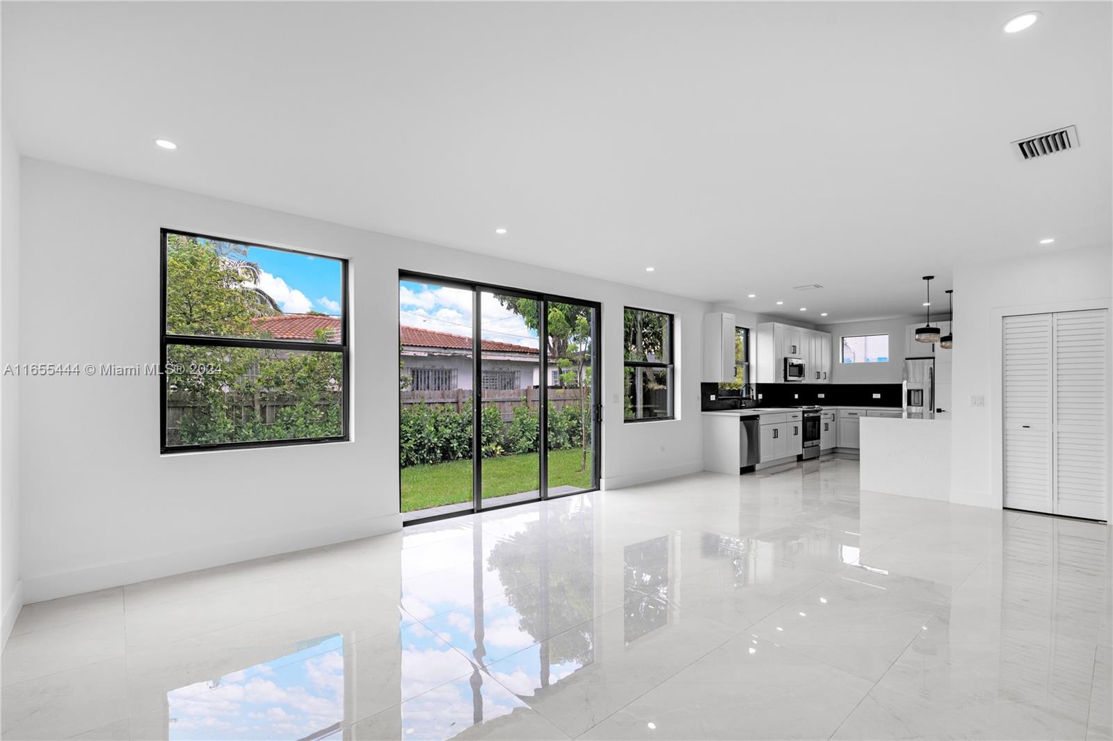 2340 Southwest 13th Street, Unit 2340 Miami, FL 33145 - Photo 9 of 26 a view of an empty room with a window