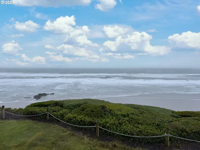 a view of a lake with a yard