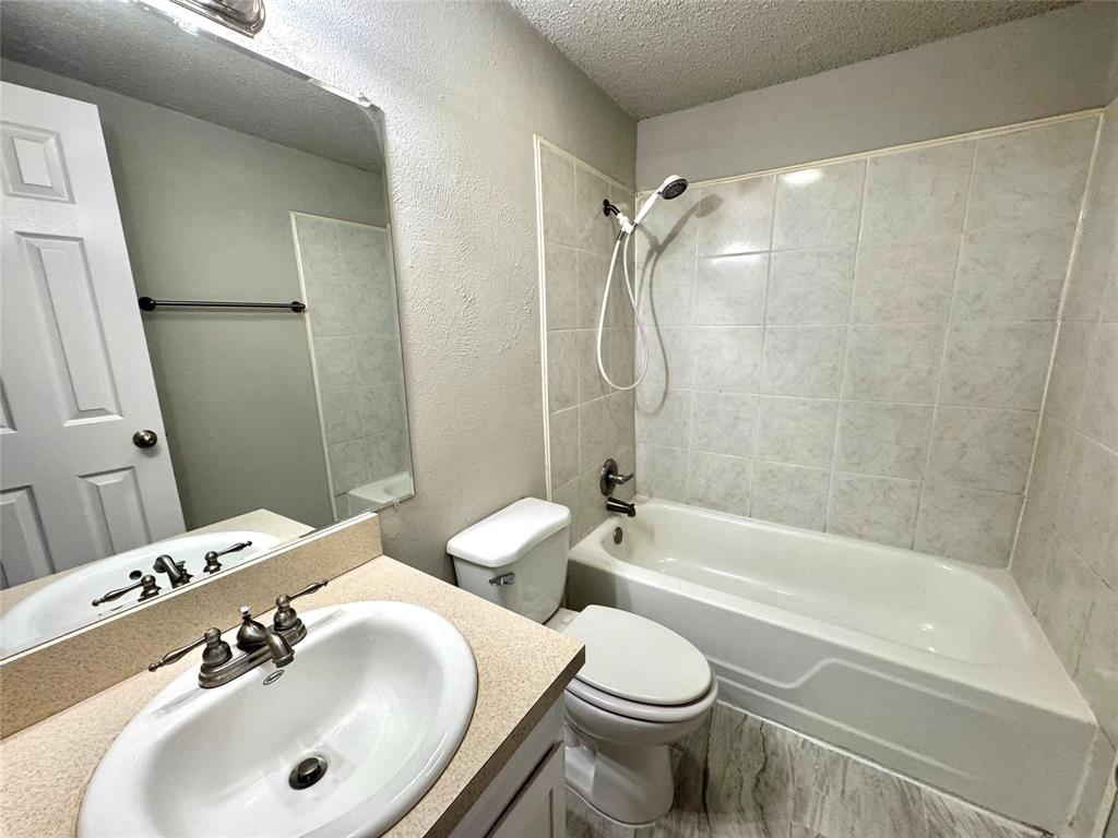 2508 South Center Street Arlington, TX 76014 - Photo 13 of 17 a bathroom with a sink toilet and shower