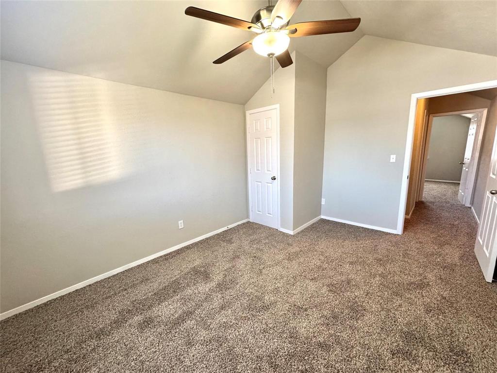 2508 South Center Street Arlington, TX 76014 - Photo 15 of 17 a view of a room with a ceiling fan and a window