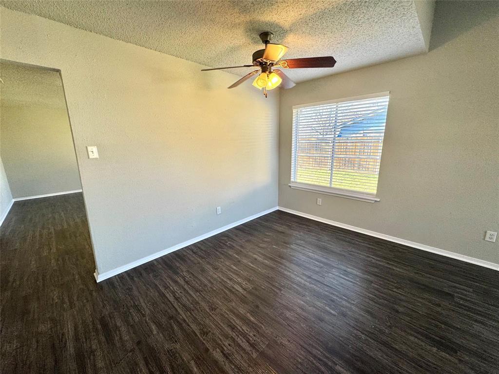 2508 South Center Street Arlington, TX 76014 - Photo 3 of 17 an empty room with wooden floor and windows