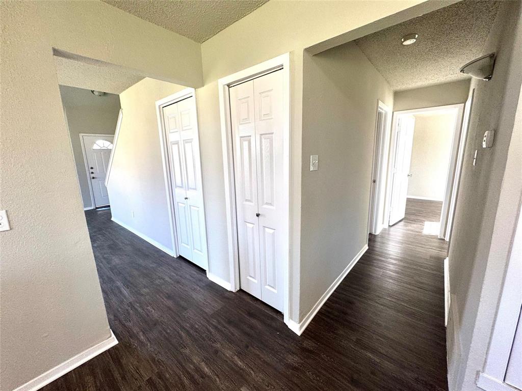 2508 South Center Street Arlington, TX 76014 - Photo 5 of 17 a view of a hallway with wooden floor and stairs