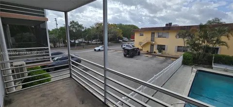 a view of a balcony with chairs