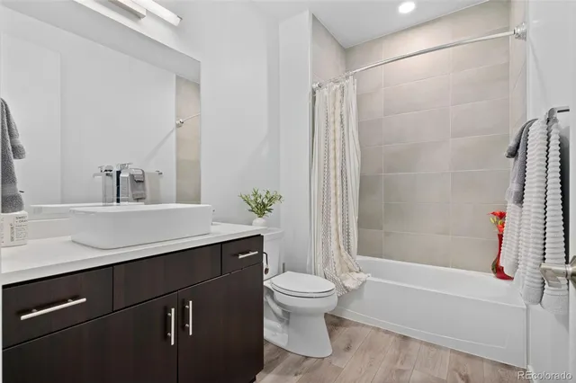 a bathroom with a sink a toilet and a bathtub