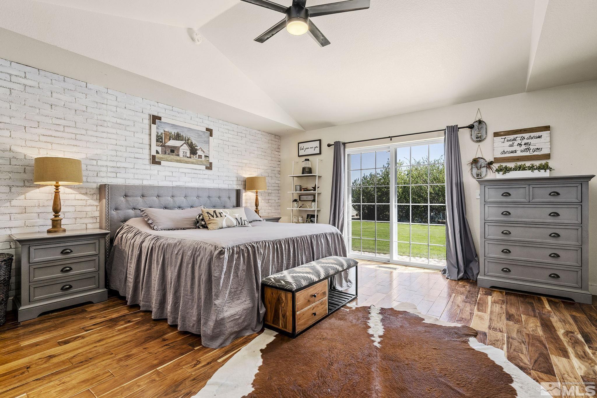 11090 Wagon Ho Lane Reno, NV 89508 - Photo 14 of 33 a spacious bedroom with a bed and a window