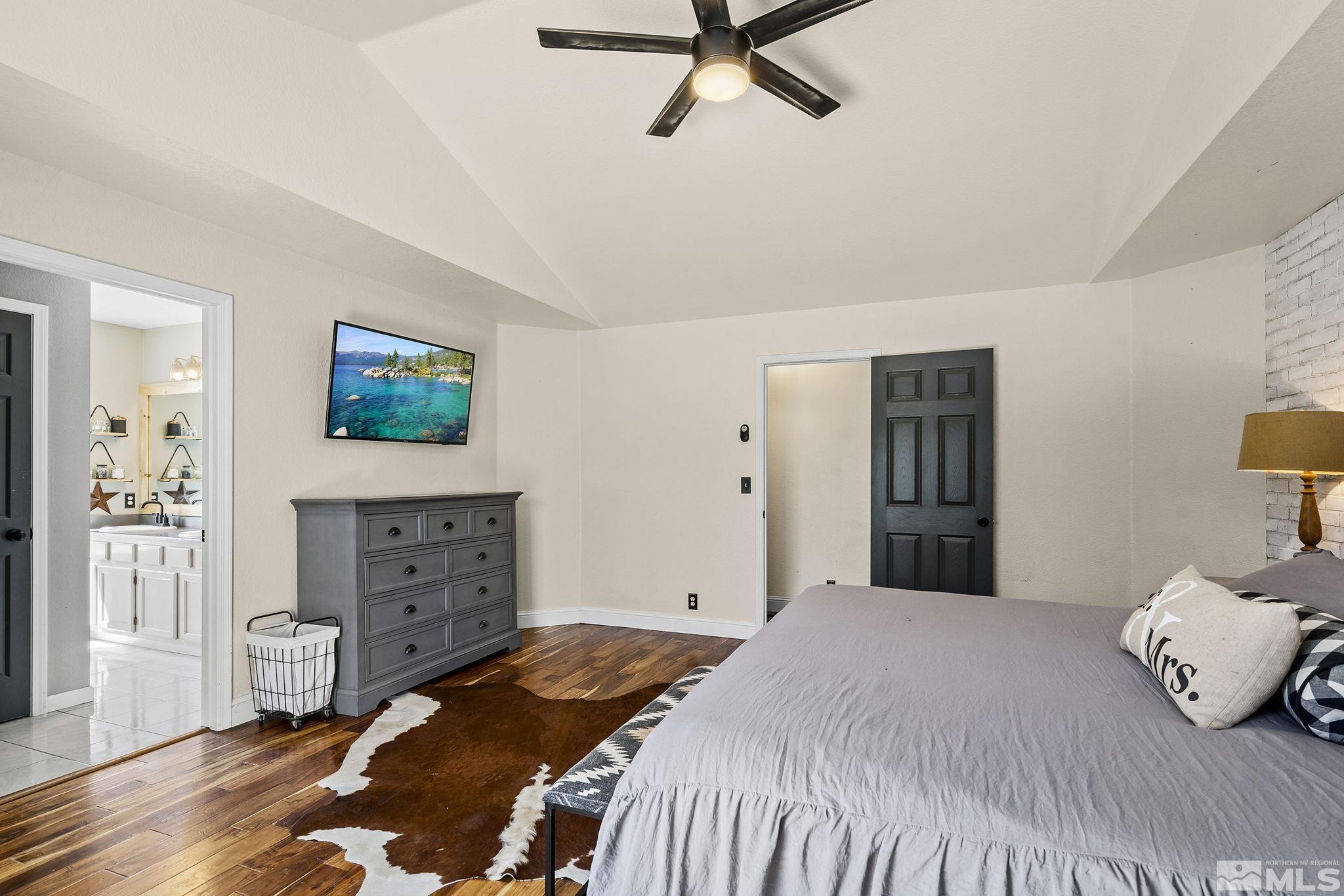 11090 Wagon Ho Lane Reno, NV 89508 - Photo 15 of 33 a bedroom with a bed and wooden floor