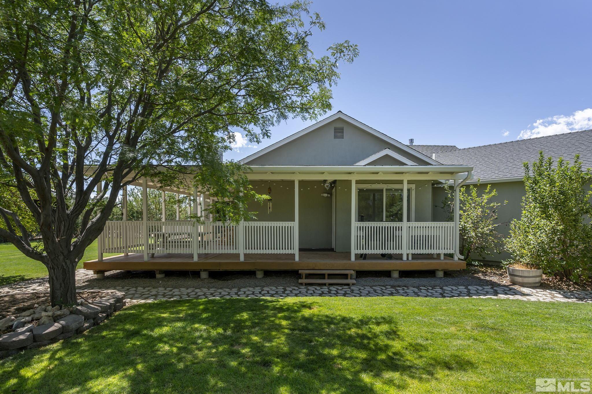 11090 Wagon Ho Lane Reno, NV 89508 - Photo 22 of 33 a front view of a house with a garden