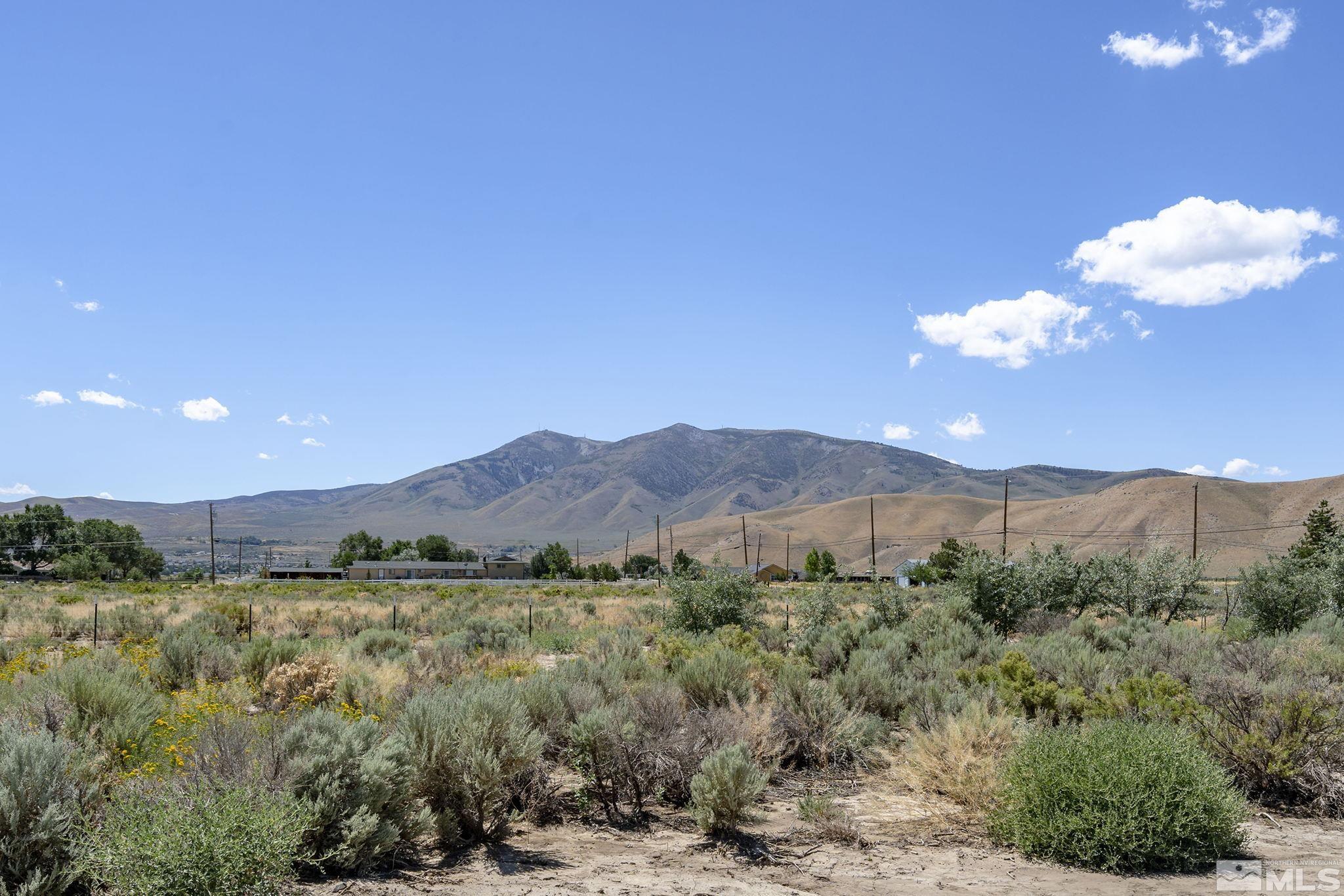 11090 Wagon Ho Lane Reno, NV 89508 - Photo 26 of 33 a view of a lake with mountains in the background