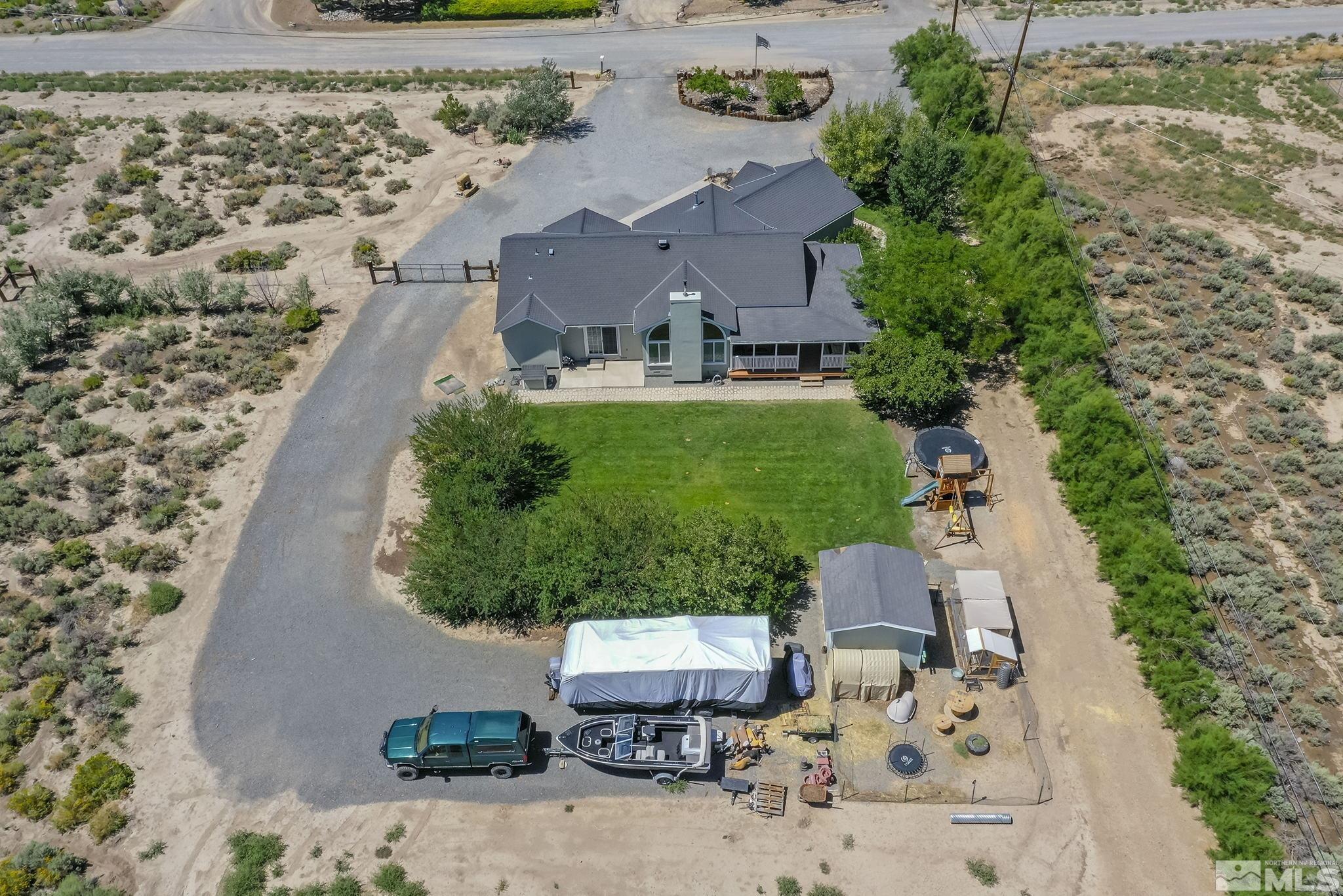 11090 Wagon Ho Lane Reno, NV 89508 - Photo 32 of 33 an aerial view of a house with a yard and garden