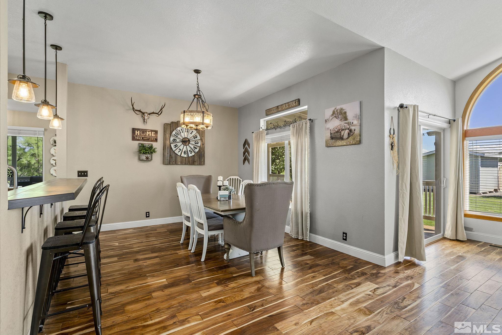 11090 Wagon Ho Lane Reno, NV 89508 - Photo 9 of 33 a view of a dining room with furniture window and wooden floor