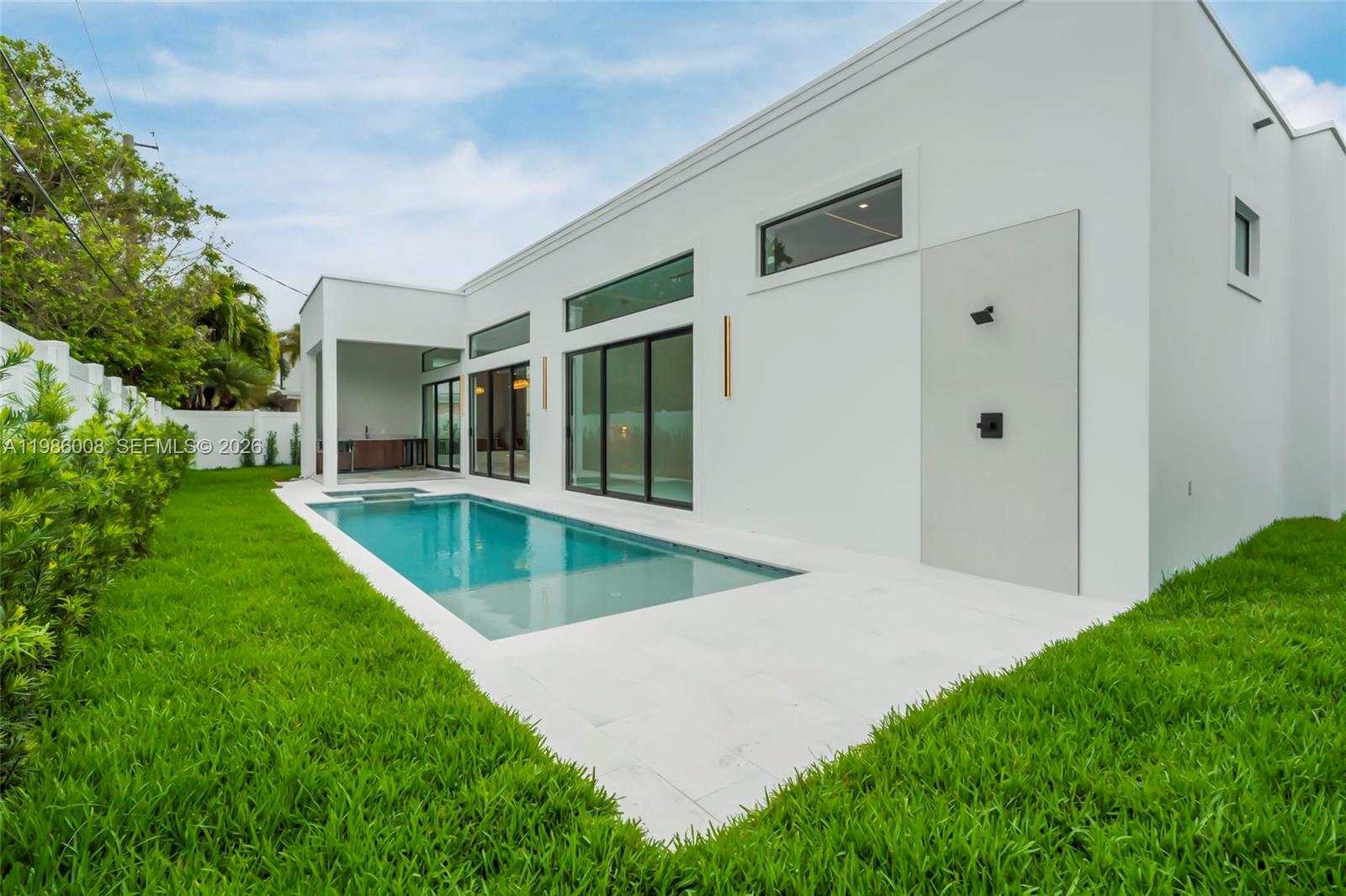 2755 Northeast 31st Court Lighthouse Point, FL 33064 - Photo 19 of 24 a view of an house with swimming pool and yard