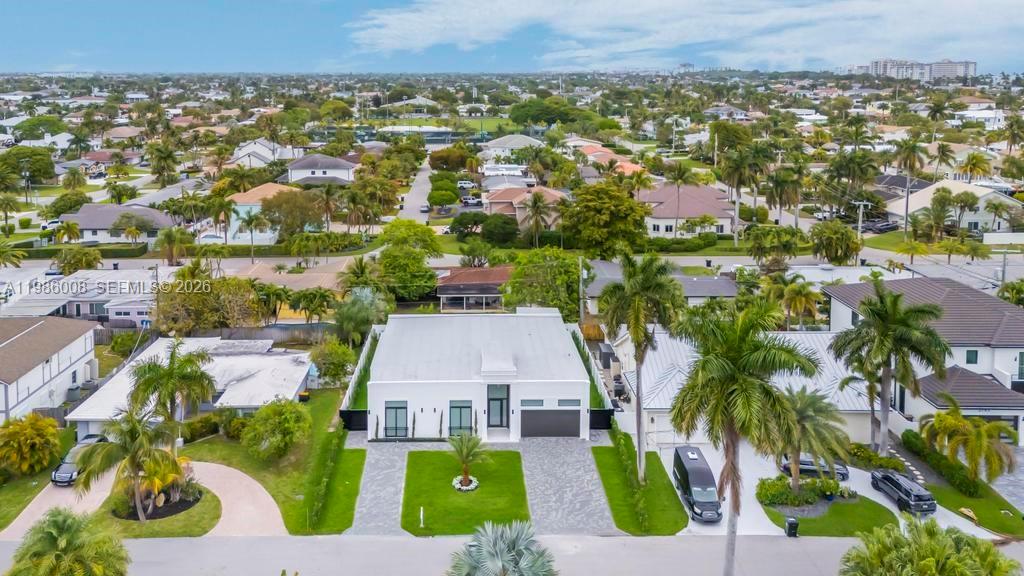 2755 Northeast 31st Court Lighthouse Point, FL 33064 - Photo 23 of 24 an aerial view of residential houses with outdoor space and swimming pool
