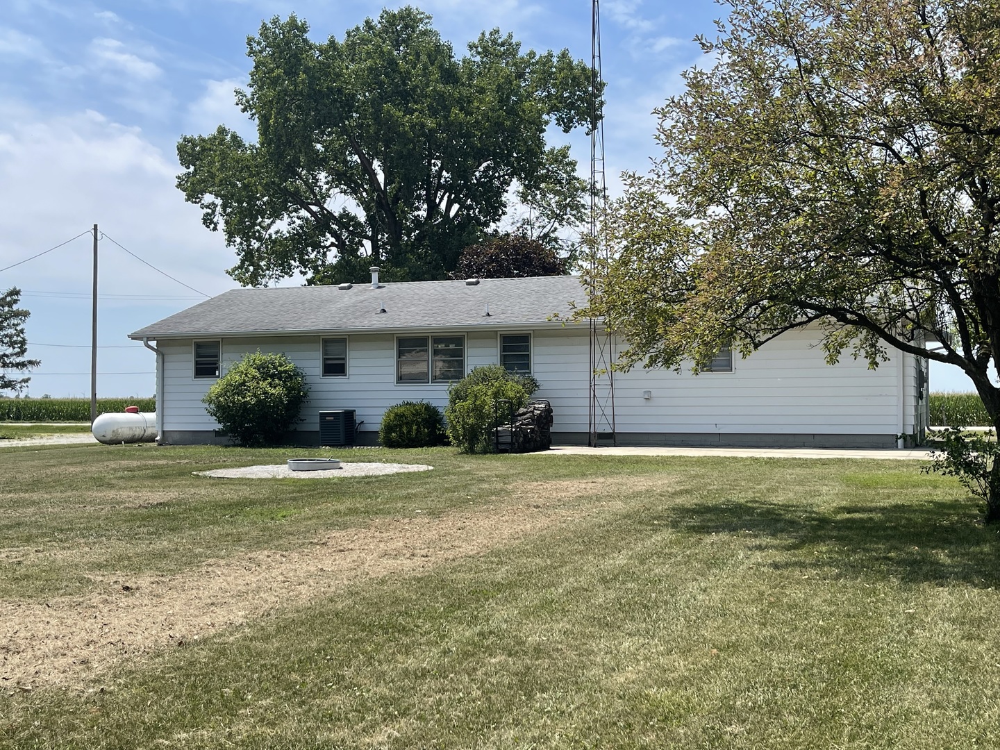 2775 Highway 115 Kankakee, IL 60901 - Photo 3 of 8 a front view of a house with a yard and garage