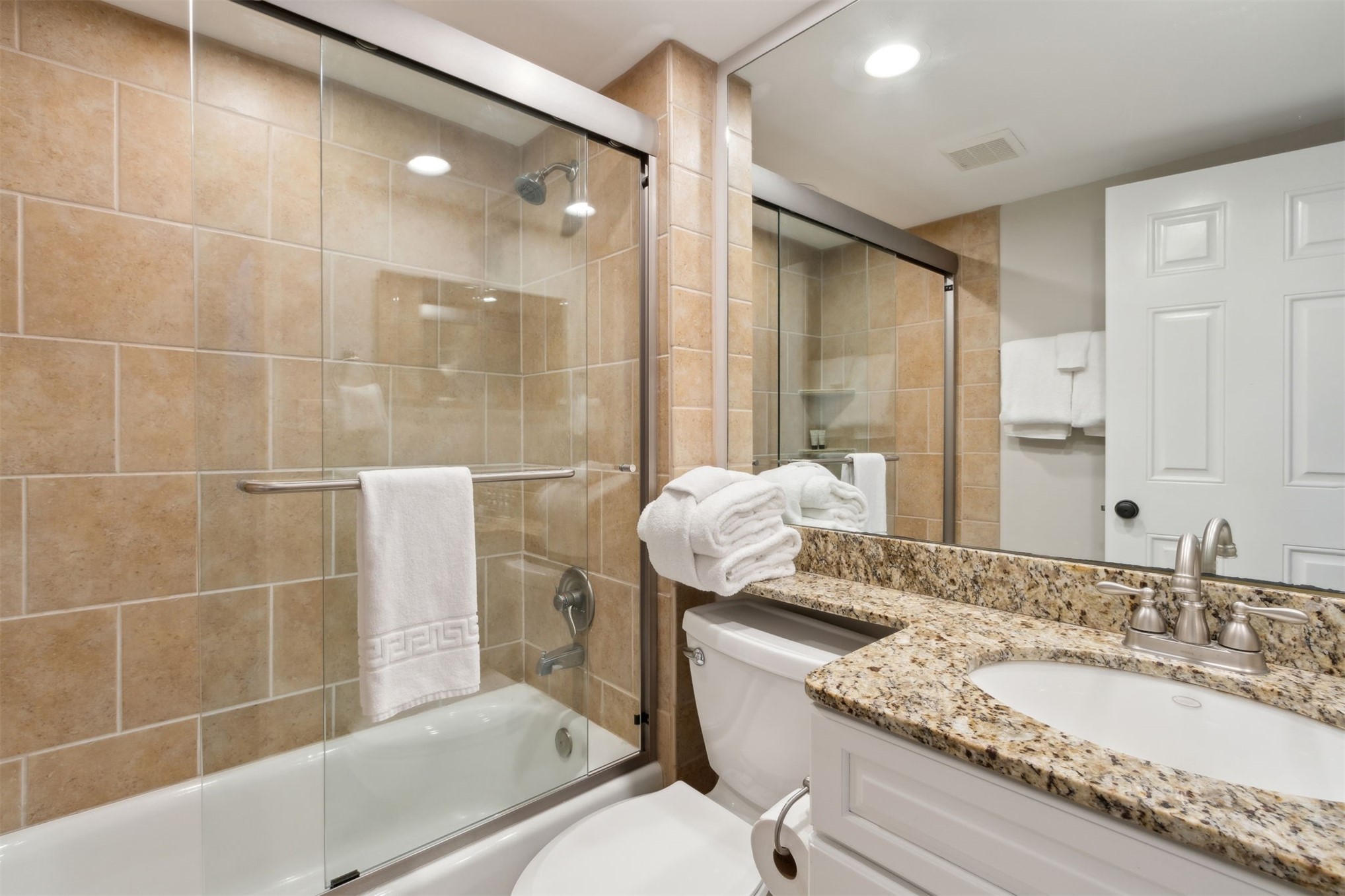 1165 Beach Walker Road, Unit 1165 Fernandina Beach, FL 32034 - Photo 17 of 45 a bathroom with a granite countertop sink a toilet and shower