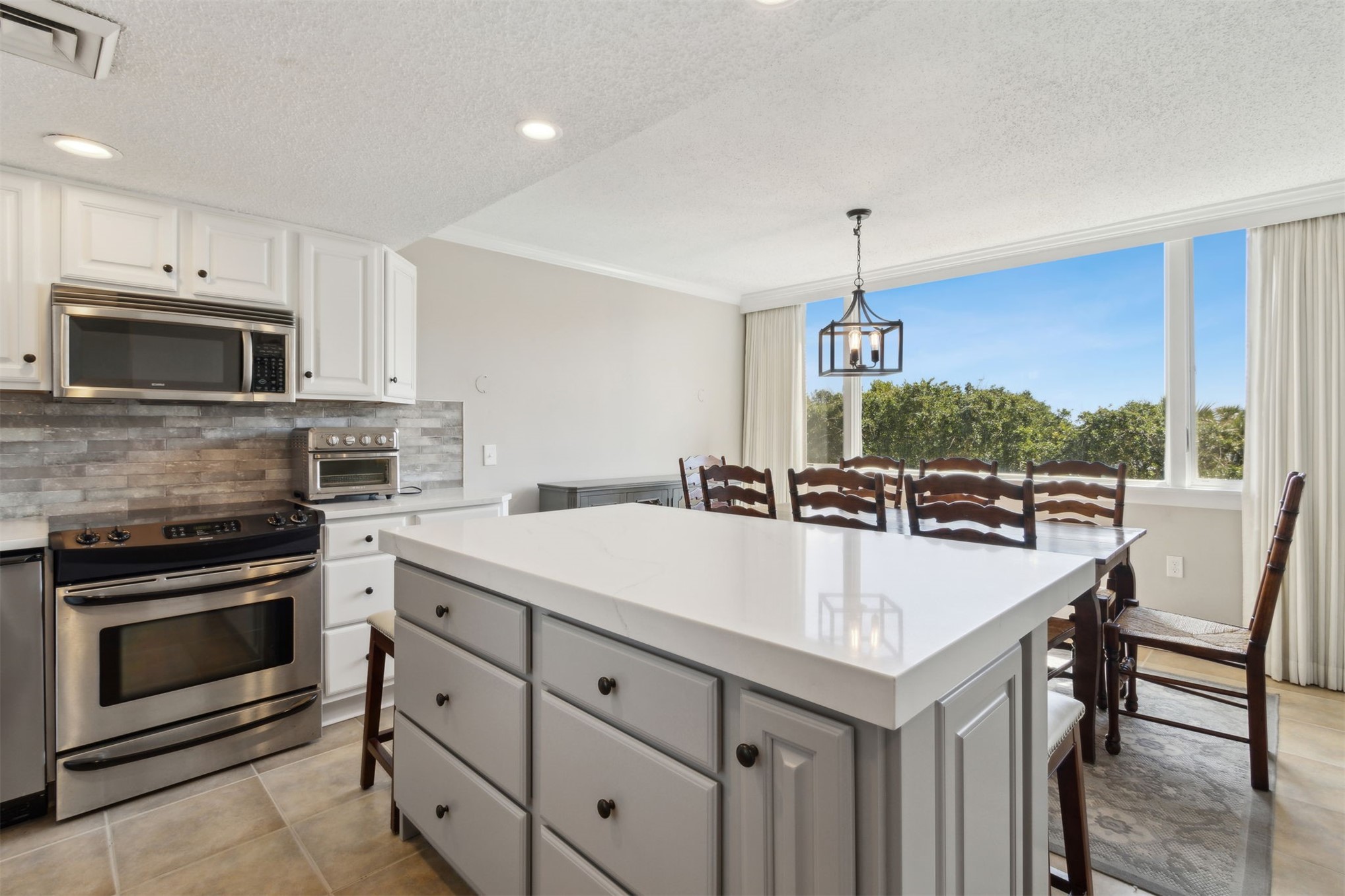 1165 Beach Walker Road, Unit 1165 Fernandina Beach, FL 32034 - Photo 2 of 45 a view of kitchen with sink microwave and stove