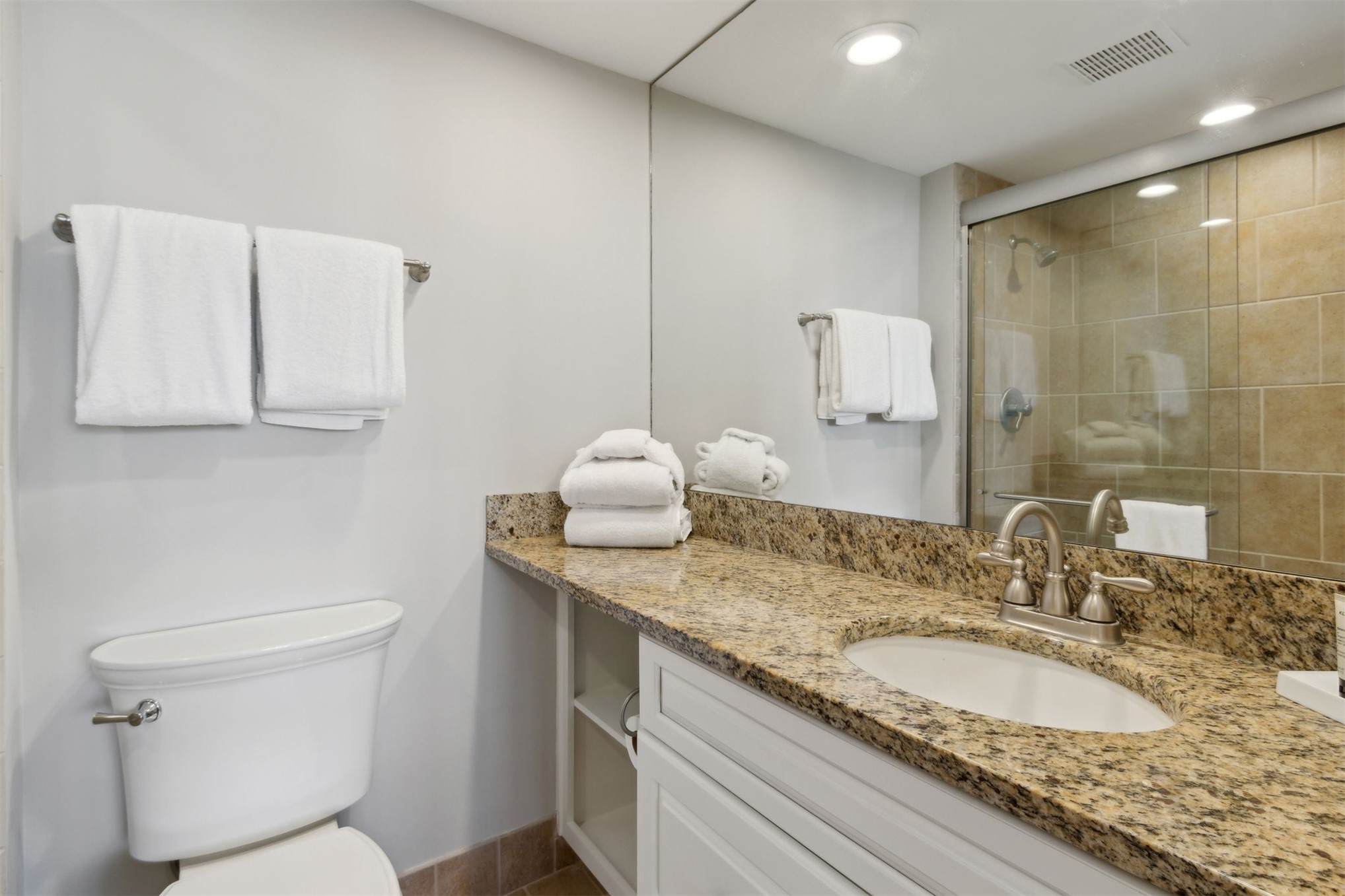 1165 Beach Walker Road, Unit 1165 Fernandina Beach, FL 32034 - Photo 26 of 45 a bathroom with a granite countertop sink a toilet and a mirror