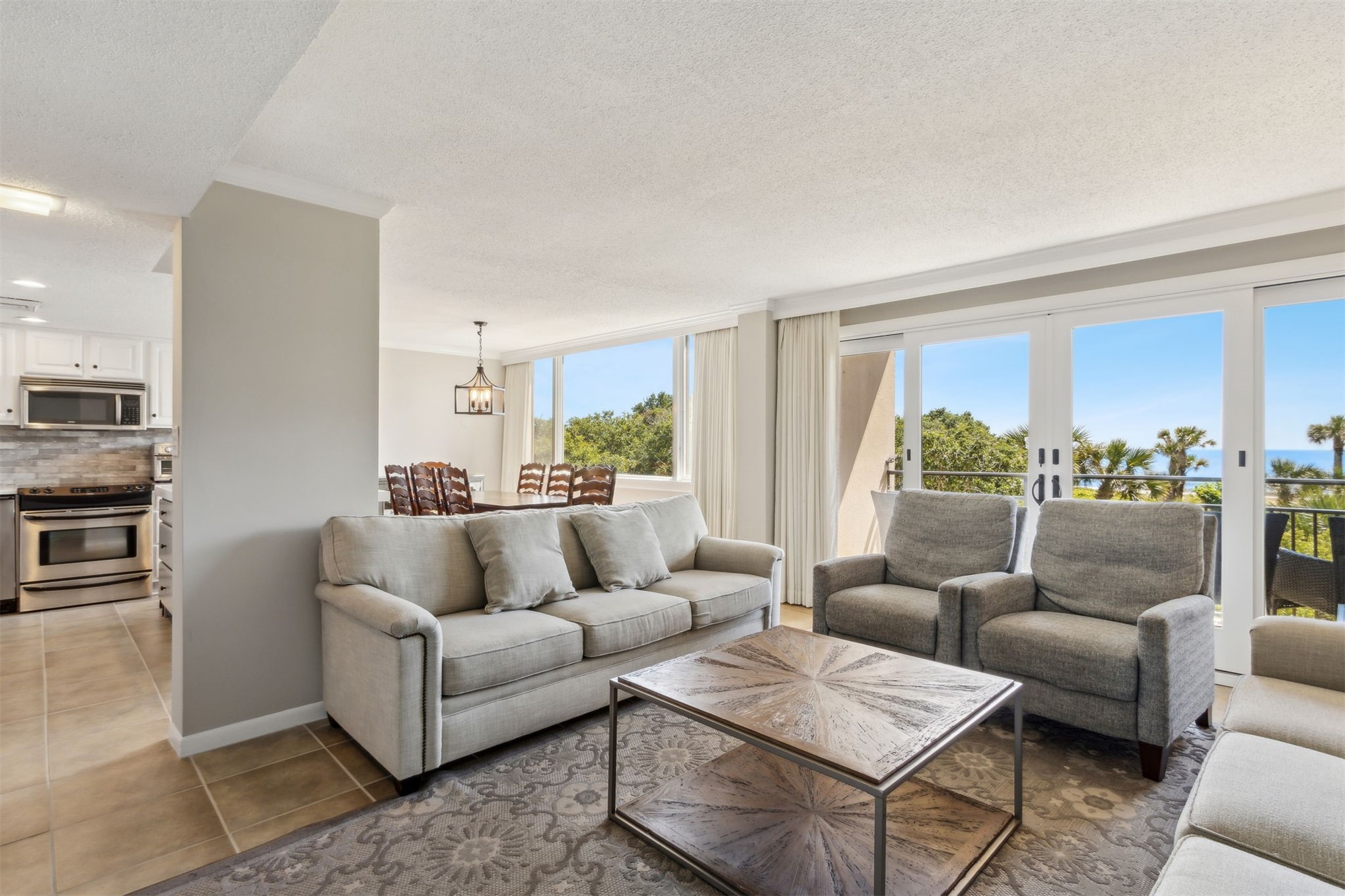 1165 Beach Walker Road, Unit 1165 Fernandina Beach, FL 32034 - Photo 7 of 45 a living room with furniture and a large window