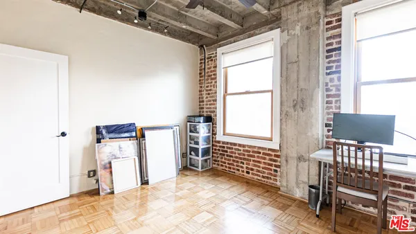 a view of a livingroom with furniture and a window