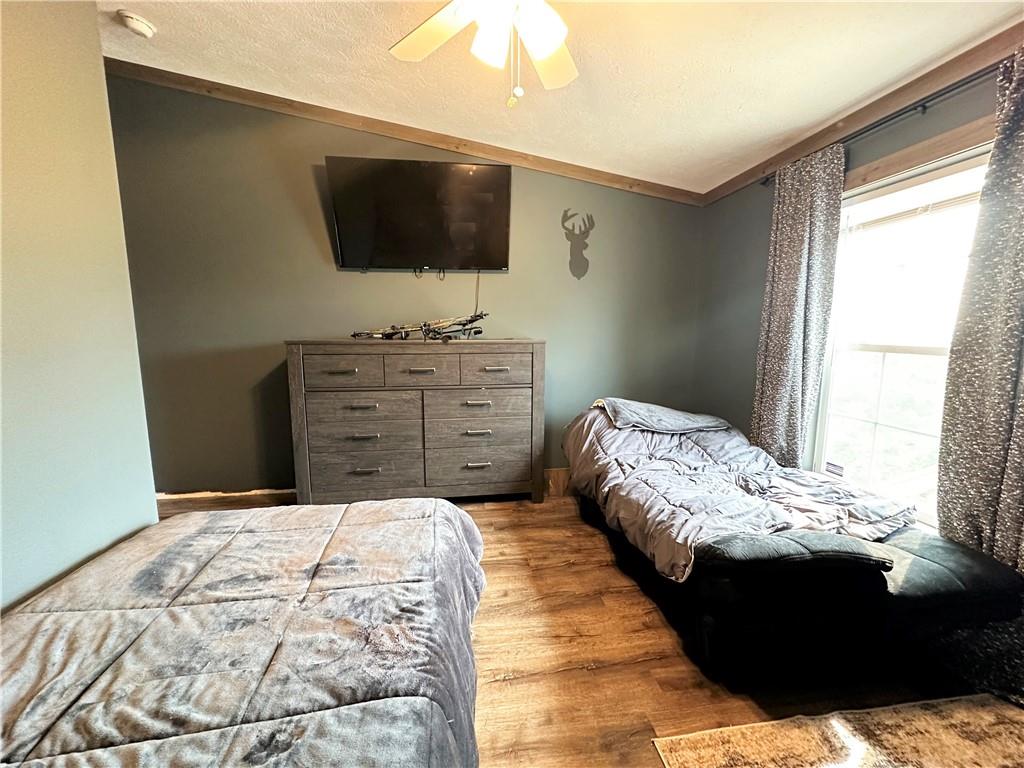 167 Poplar Road Avella, PA 15312 - Photo 21 of 34 a bedroom with a bed and a flat screen tv