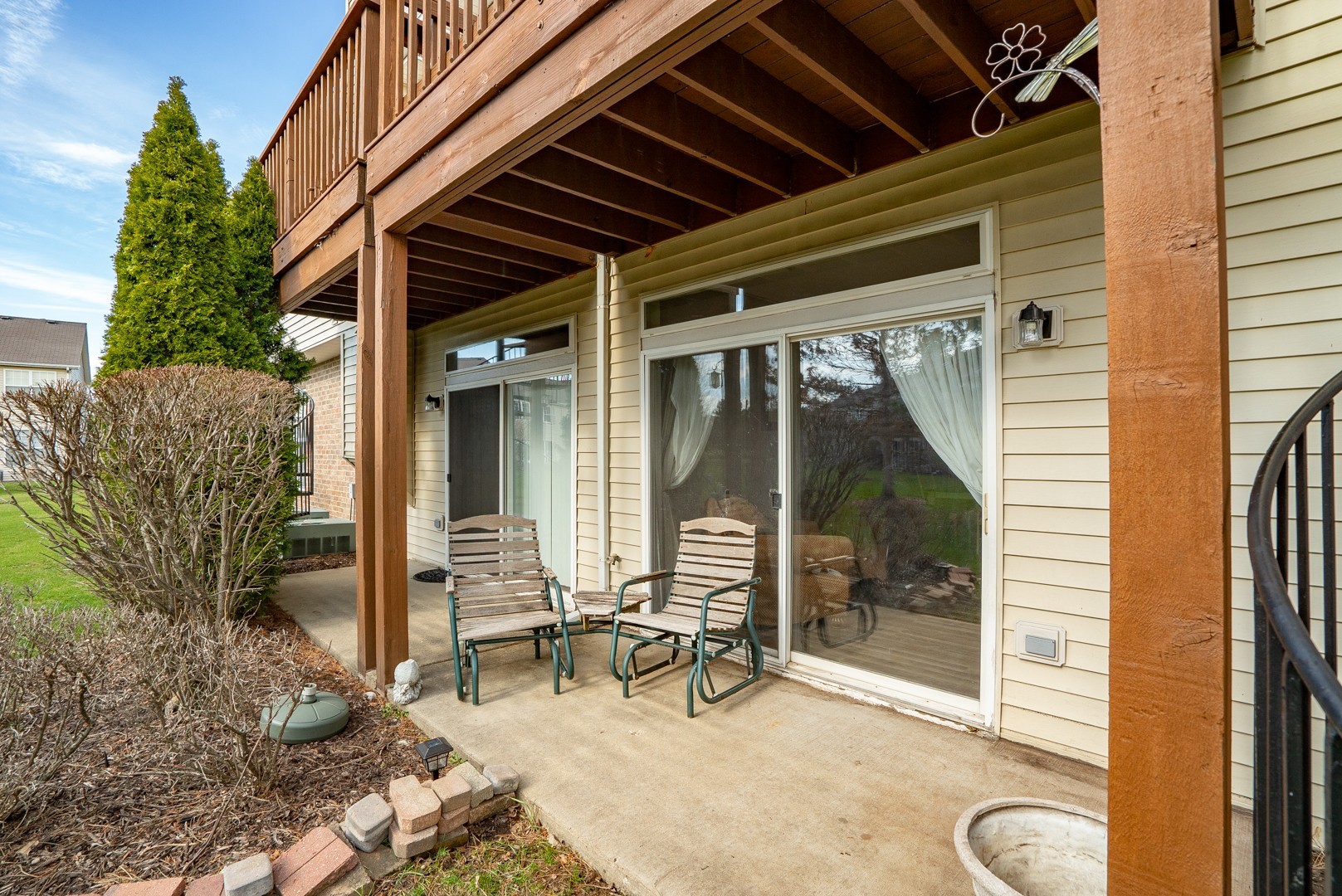 24100 Pear Tree Circle Plainfield, IL 60585 - Photo 12 of 13 a view of a porch with chairs and floor to ceiling window and wooden fence