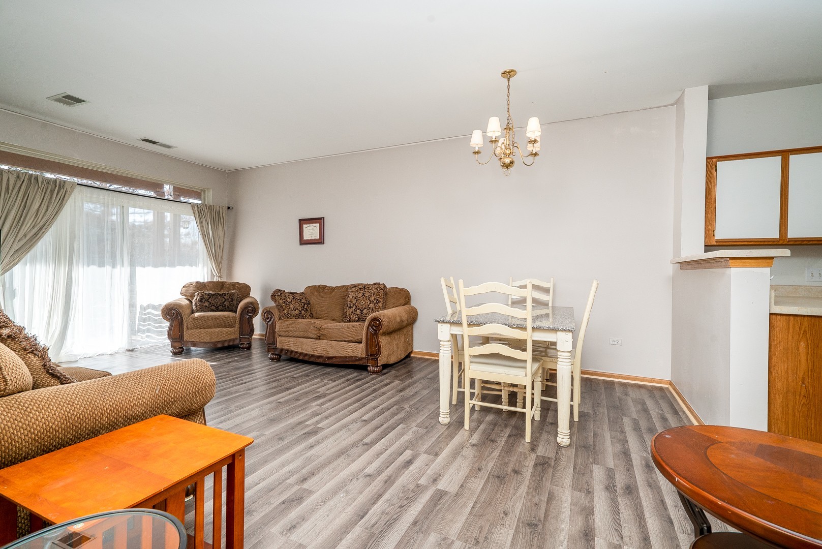 24100 Pear Tree Circle Plainfield, IL 60585 - Photo 2 of 13 a living room with furniture and a wooden floor