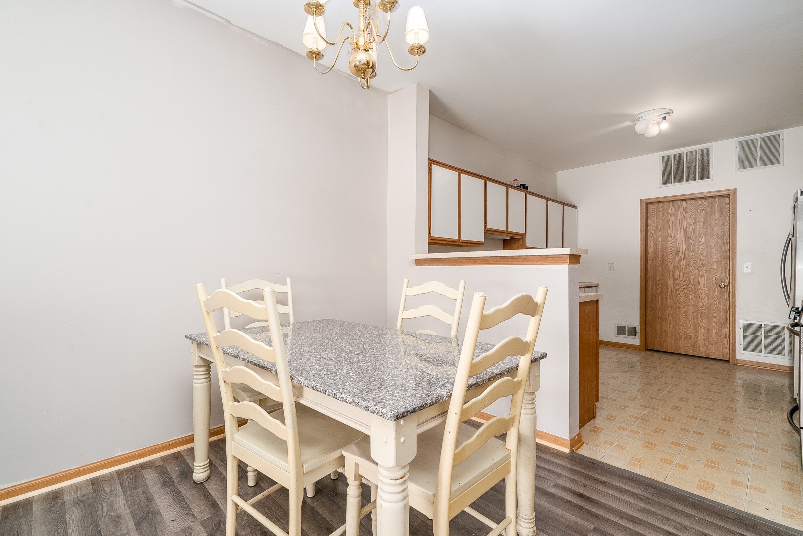 24100 Pear Tree Circle Plainfield, IL 60585 - Photo 3 of 13 a view of a dining room with furniture and chandelier