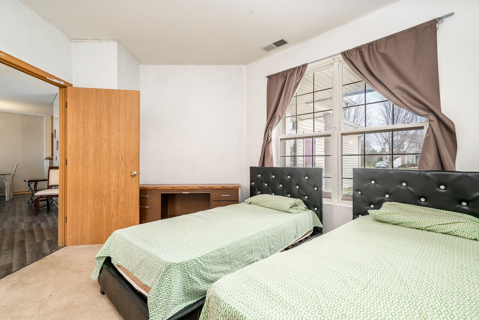 24100 Pear Tree Circle Plainfield, IL 60585 - Photo 10 of 13 a bedroom with two beds and a large window