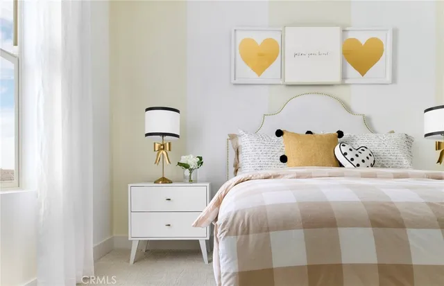 a bedroom with a bed and a painting on the wall