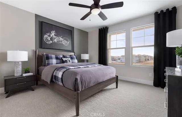 a bedroom with a bed and a painting on the wall