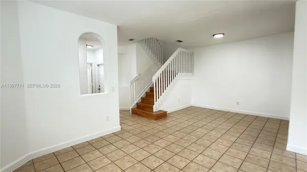 a kitchen with a sink cabinets and window