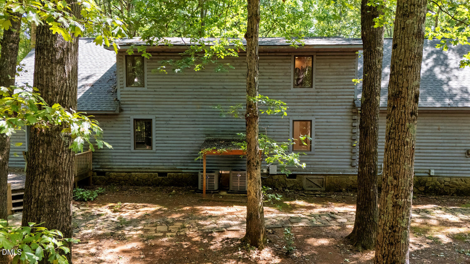 7391 Howerton Road Elon, NC 27244 - Photo 49 of 53 Two-story property with gray horizontal siding, multiple windows, and a dark shingle roof