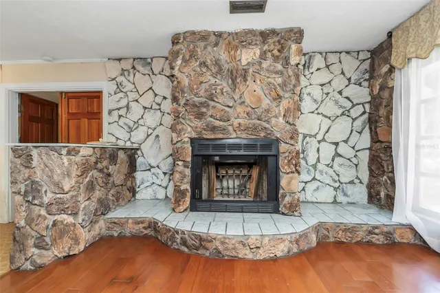 a kitchen with a stove a table and chairs