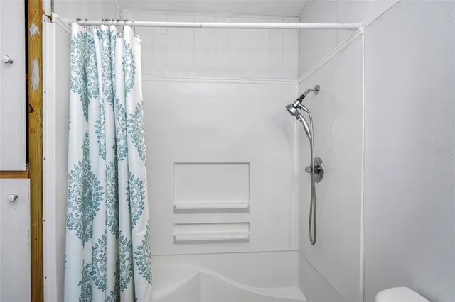 a utility room with cabinets dryer and washer