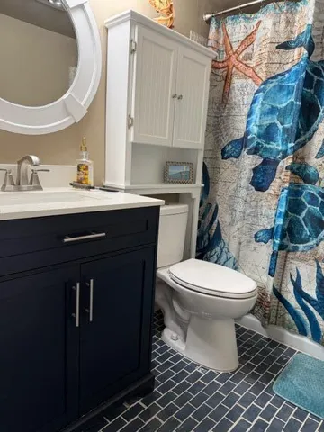 a bathroom with a sink and a toilet