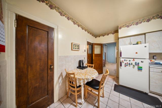 41-71 Gleane Street Queens, NY 11373 - Photo 16 of 28 a dining room with furniture and wooden floor