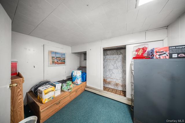 41-71 Gleane Street Queens, NY 11373 - Photo 22 of 28 a room with furniture and a table