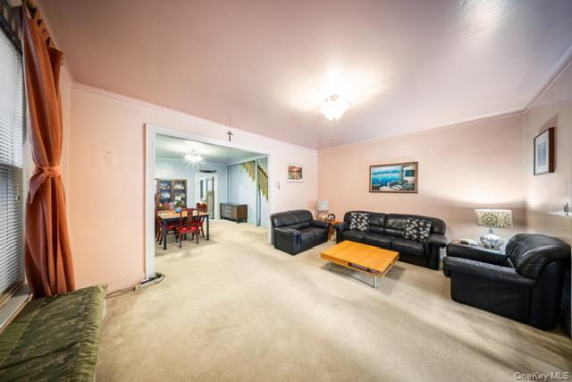 41-71 Gleane Street Queens, NY 11373 - Photo 24 of 28 a bedroom with furniture and a bed