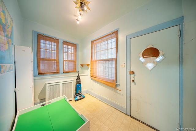 41-71 Gleane Street Queens, NY 11373 - Photo 26 of 28 a bedroom with a bed and a large window