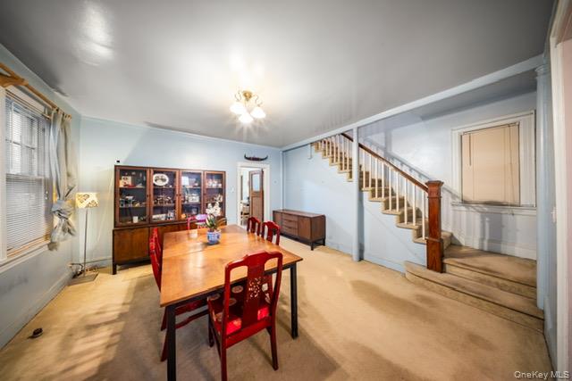 41-71 Gleane Street Queens, NY 11373 - Photo 27 of 28 a view of a livingroom with furniture hardwood floor and a ceiling fan