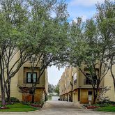 a front view of a building with trees