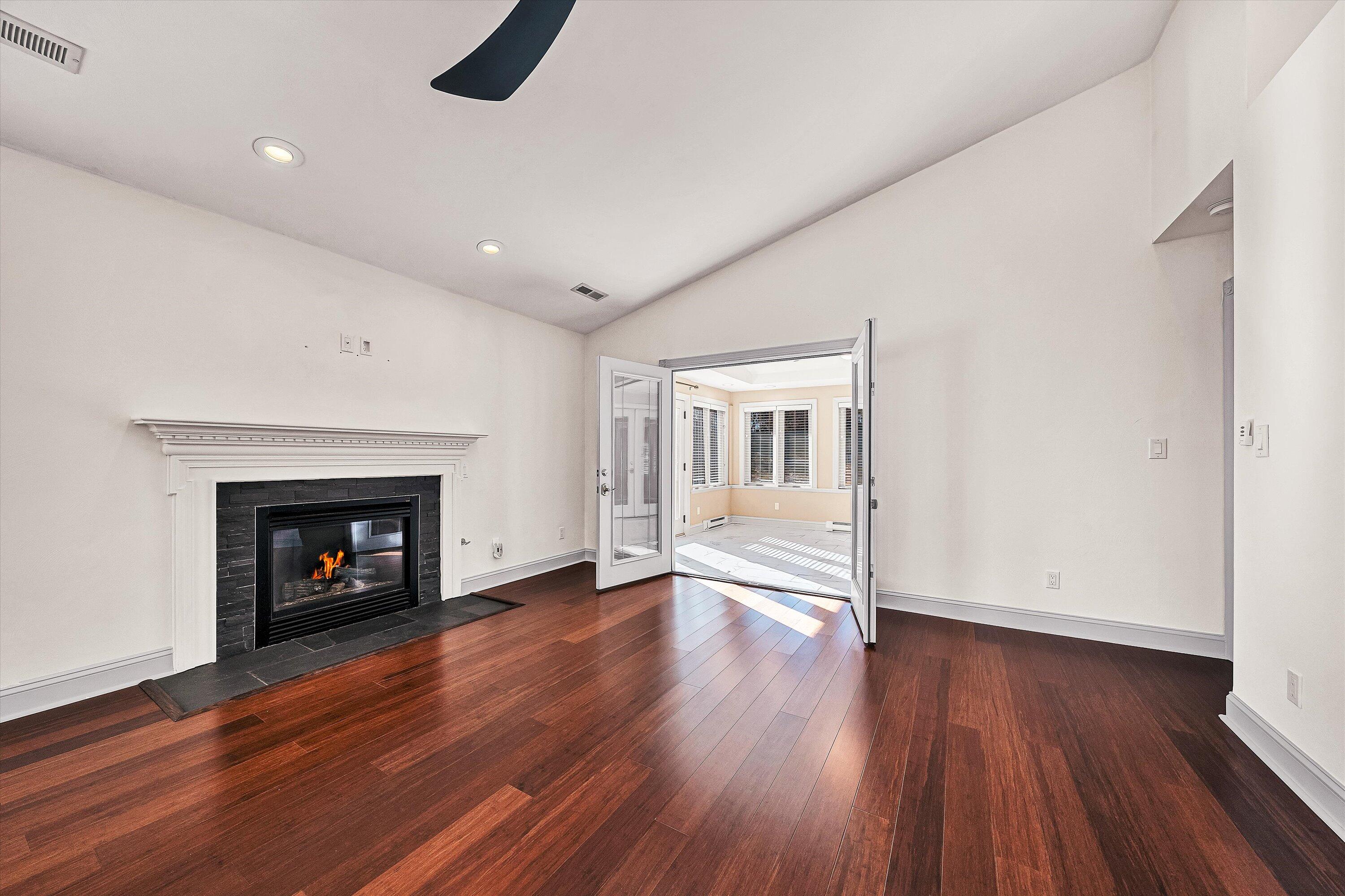 4530 Colonial Pl Drive Roanoke, VA 24018 - Photo 17 of 39 a view of an empty room with wooden floor fireplace and a window