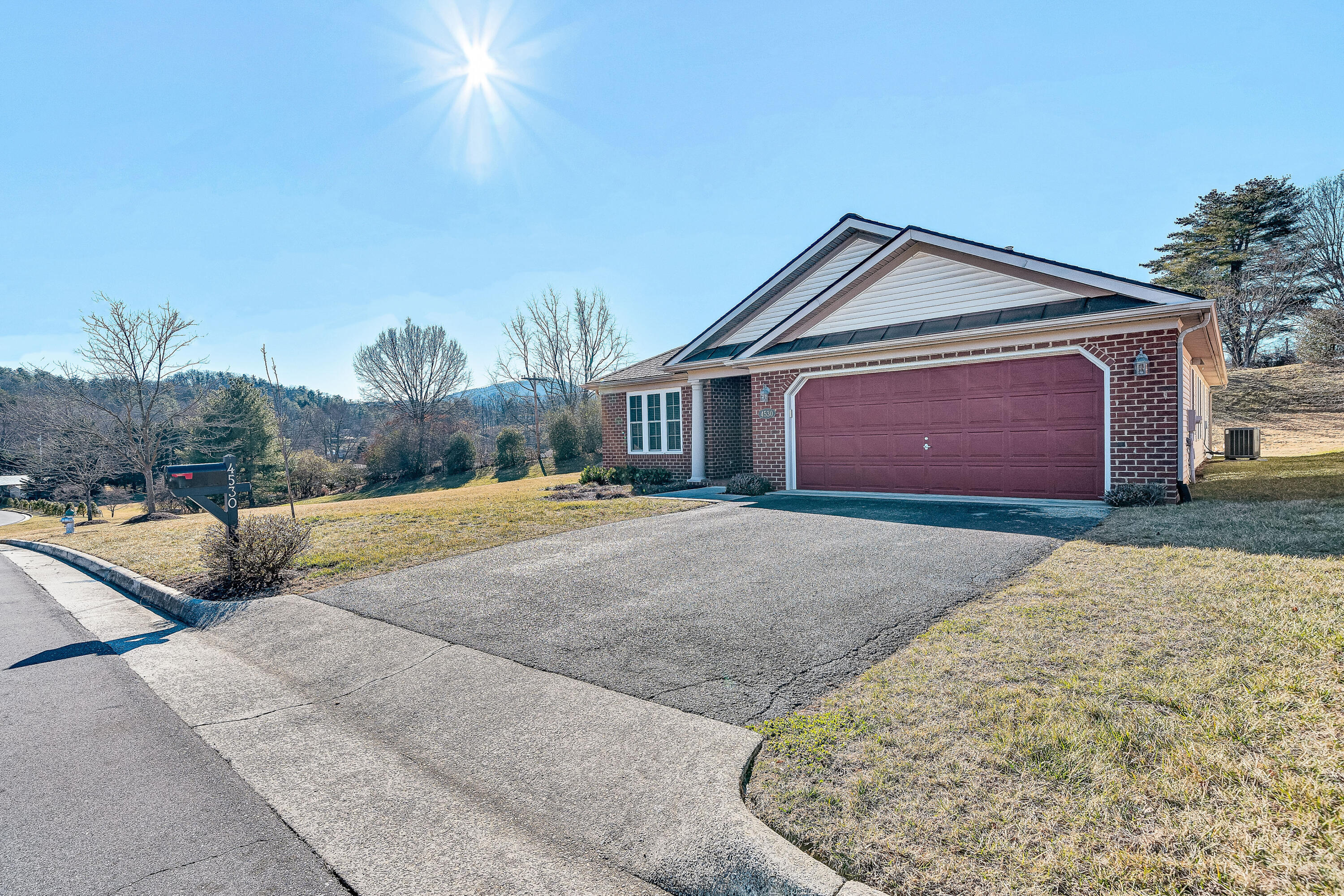 4530 Colonial Pl Drive Roanoke, VA 24018 - Photo 2 of 39 a front view of a house with a yard and garage
